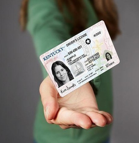 girl holding her Kentucky Real ID